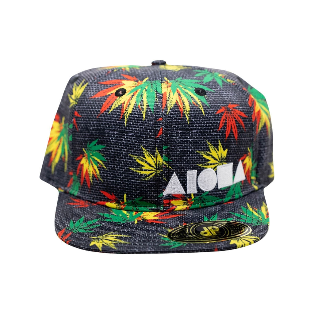 Black adult Flatbrim snapback hat printed with red, yellow and green ganja leaves. Embroidered with white Aloha Shapes® logo